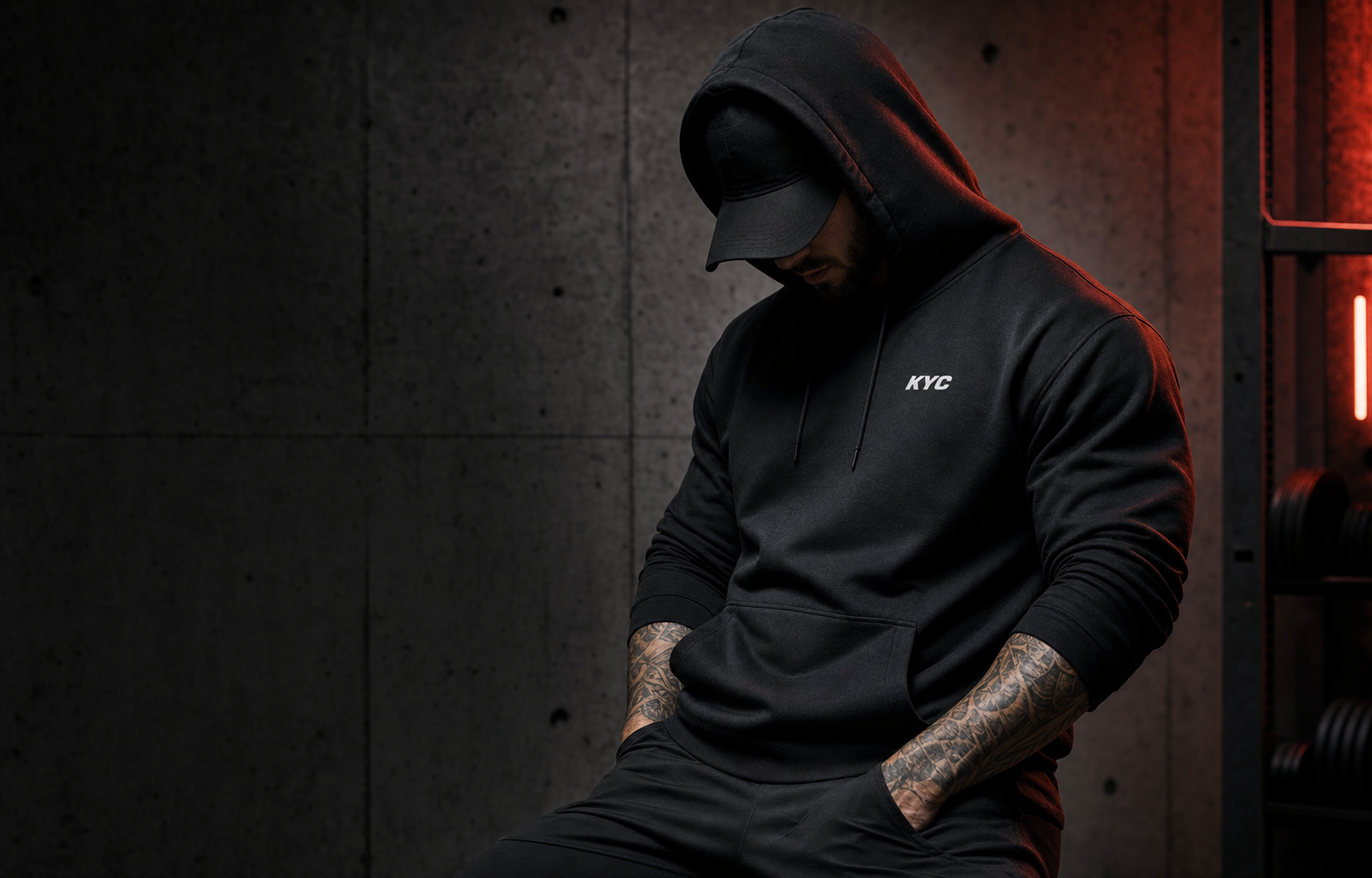 KYC athlete wearing a black performance hoodie
